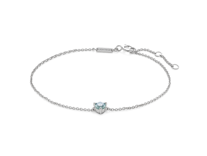 Front view of blue 0.25 carat round brilliant solitaire bracelet in 14k white gold