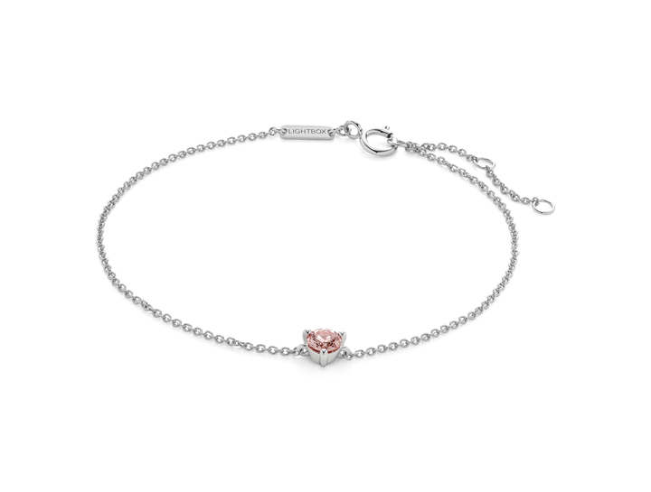 Front view of pink 0.25 carat round brilliant solitaire bracelet in 14k white gold
