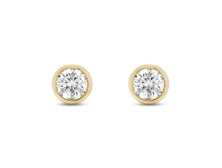 Front view of white 1 carat total weight round brilliant studs in a 14k yellow gold bezel setting